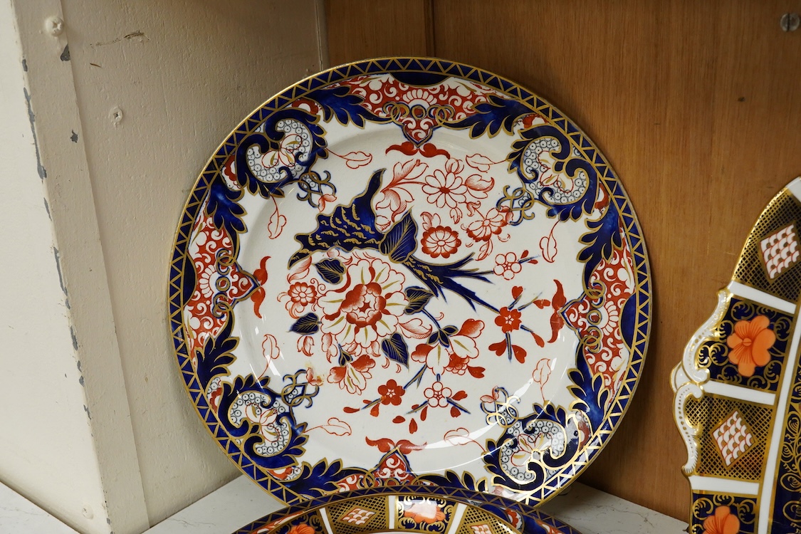 A quantity of Royal Crown Derby Imari to include a sandwich plate, cups and saucers and and miniature twin handled cups, largest 27cm in diameter